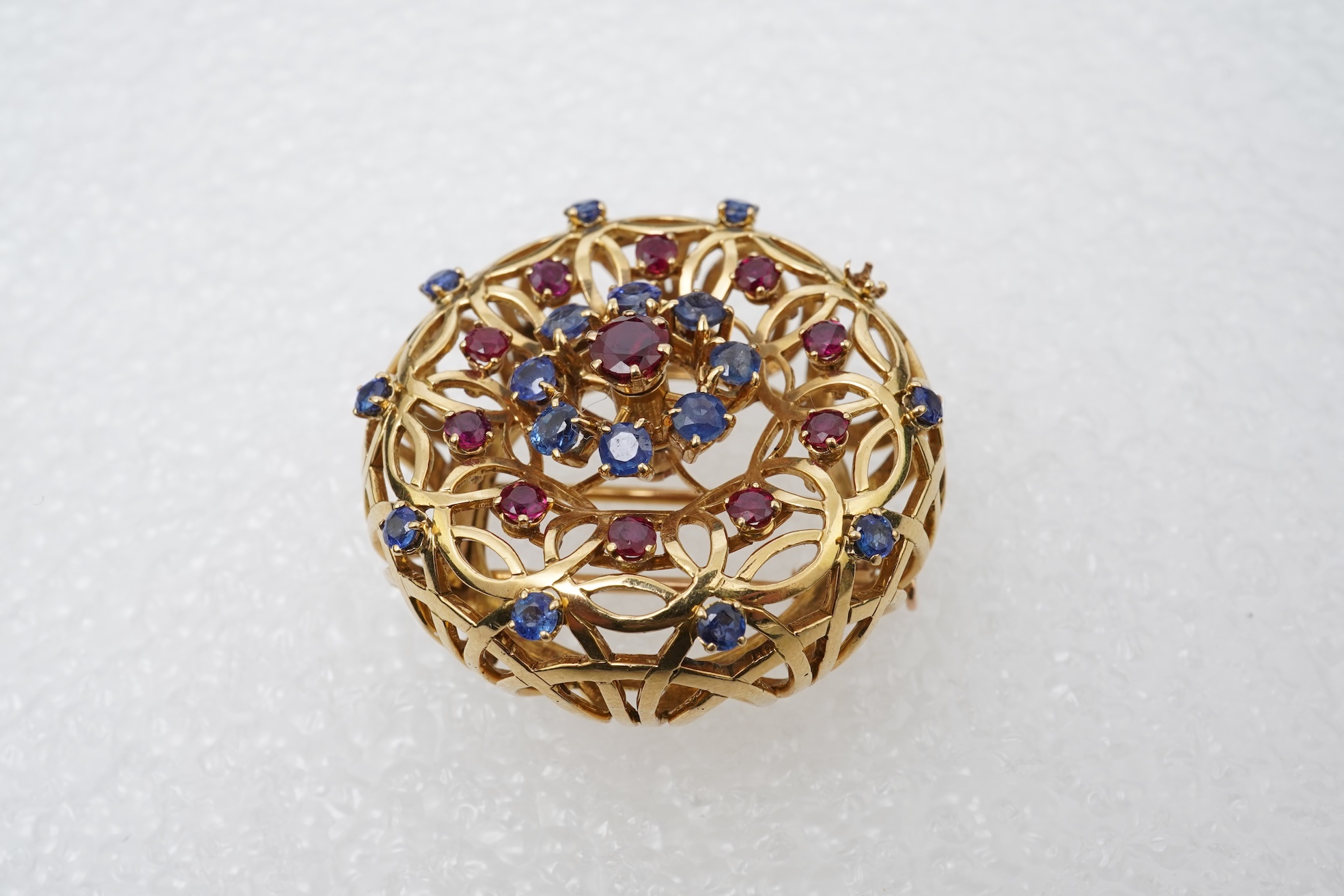 Mellerio dits Meller, a ruby and sapphire brooch, mid 20th century